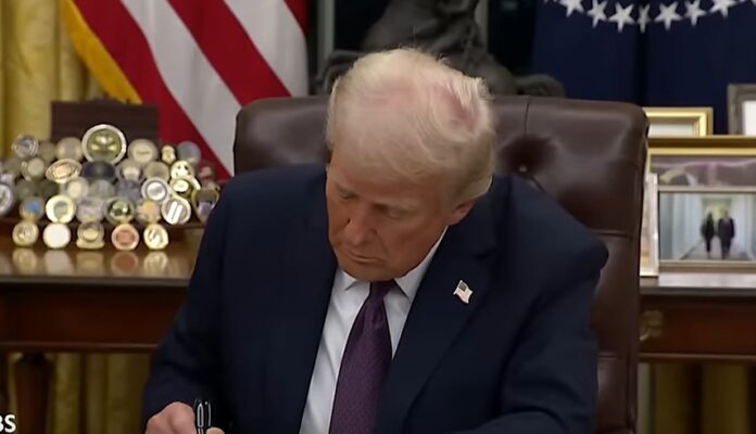 Trump signing executive orders on January 20, 2025.