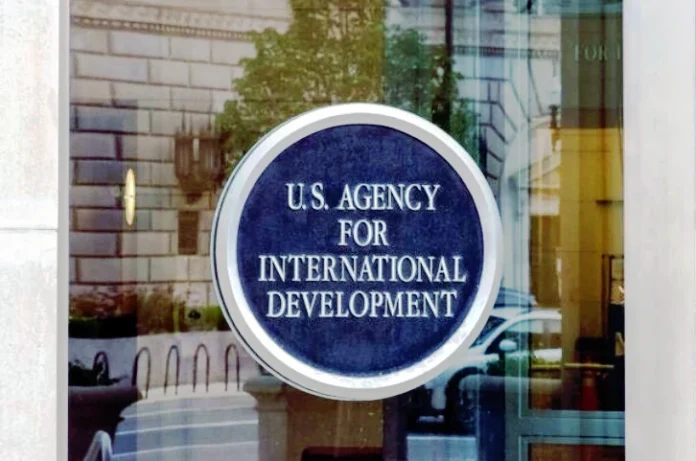 Sign at the entrance of the United States Agency for International Development (USAID) headquarters in the Ronald Reagan Building.