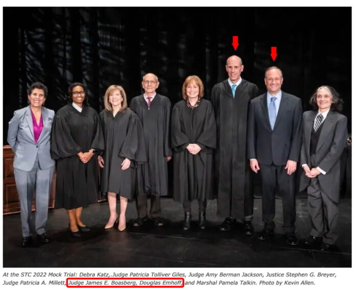 At the 2022 STC Mock Trial, a group photo featuring prominent judges and legal figures—including Judge James E. Boasberg (center right, in robe) and Second Gentleman Douglas Emhoff (right, in suit). Trump has since circulated the image, raising questions about impartiality and political proximity.